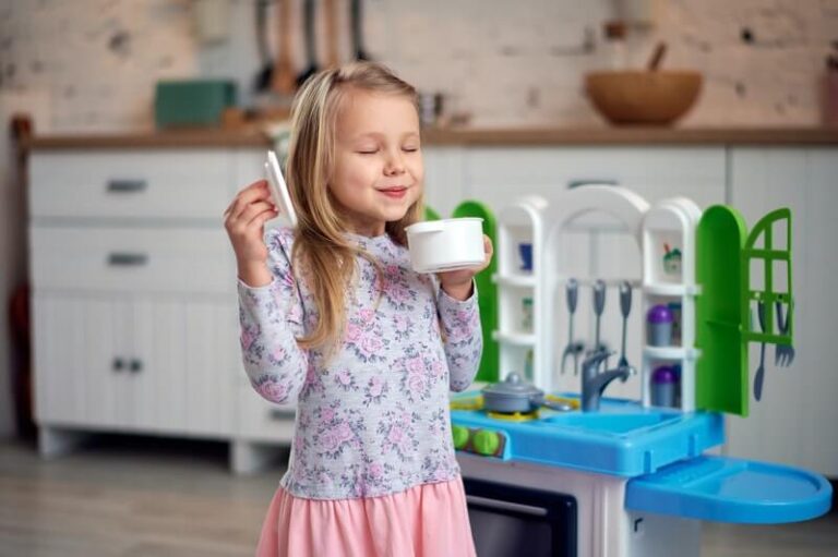 a little girl smelling cooking
