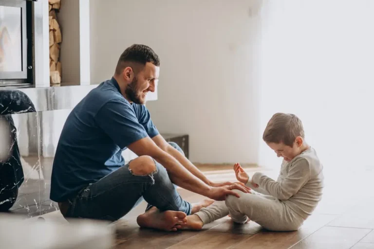 a father plays with his son