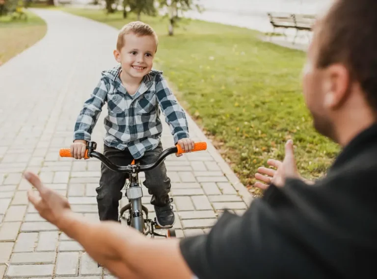 A father uses child led parenting approach with his young son