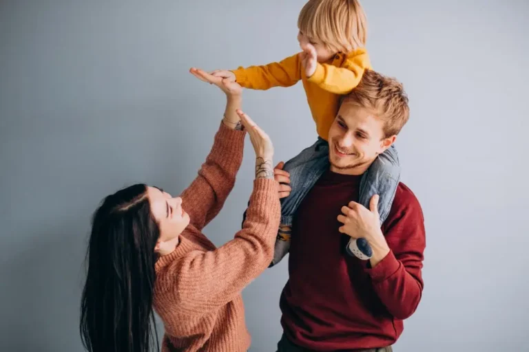 a small kid with his respectful parents