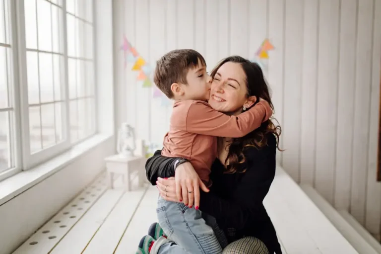 a responsive mother hugging her son