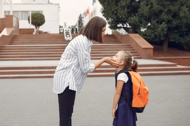 a lawnmower parent with her daughter at school